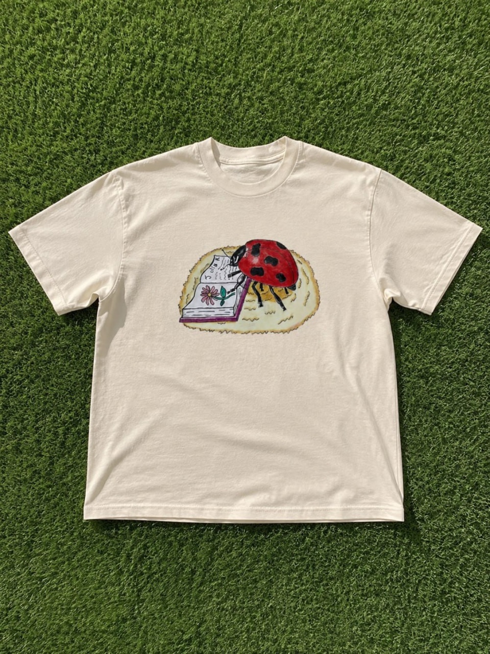 Gildan Cream Short-Sleeve Tee with Red Ladybug Graphic
